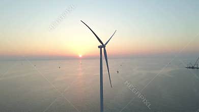 European Wind turbine Construction, Windmill in the ocean at sunset, showcasing renewable energy innovation
