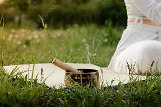 Young girl ceremony before kundalini yoga exercises. Sports woman doing mortar and pestle ritual. Female meditation