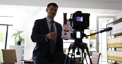 Focused male analyst explains working with data