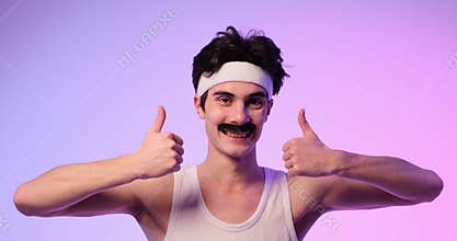 Smiling Nerd Shows Thumbs Up on Purple Background