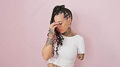 Tired hispanic amputee woman, rubbing tired eyes and aching head, stands frustrated over pink isolated background, stressed from