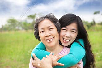 Happy woman hugging with her mother