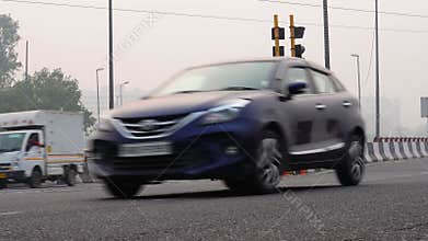 Ground Level View of Road Traffic from an Over Bridge in Delhi