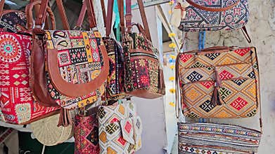Spectrum of Style Various Colored Bags Hanging in Dharamshala's Vibrant Stores