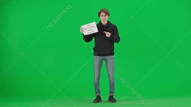 A male activist points to a placard in his hand that reads Let&#x27;s Build a Better World Together. The man holding the