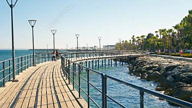 Limassol, Cyprus - August 07, 2023: The promenade alley in the Molos park along the Mediterranean sea