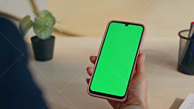 Boss hand holding mockup display cellphone at desk closeup. Woman watching phone