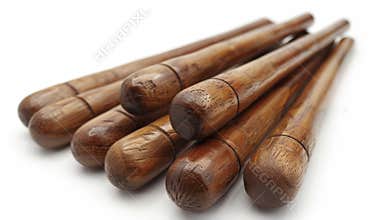 Wooden baseball bats on white surface