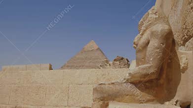 Video of a ruin statue of a Pharaoh. Great pyramids of Giza.