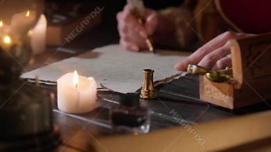 Antique female writing with old feather pen. Woman in renaissance dress writing a love letter with vintage quill pen on