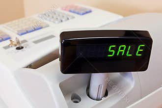 SALE on a cash register display