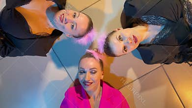 women lie on the floo