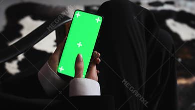 business woman using smartphone viewing green screen on mobile phone browsing chroma key online watching. Concept of