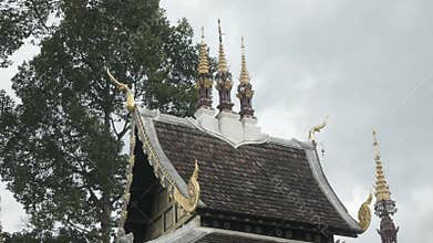look up view to the roof with decoration on top of City Pillar Shrine (San Lak Mueang) of Chiangmai city