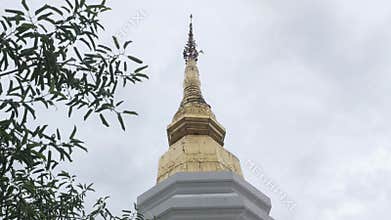 look up view to the golden beautiful pagoda against cloudy sky in Chiangmai Thailand with northern ancient design architecture