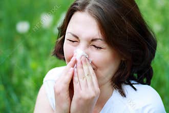Woman sneezing