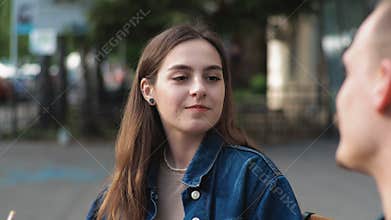 A young couple Denim clothes On a date in a vintage restaurant outside They are talking