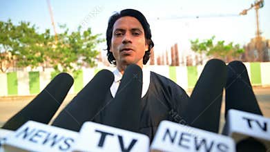 Lawyer speaking to the press at a construction site