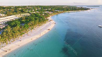 Aerial view of beautiful bungalow and sea at sunset in summer