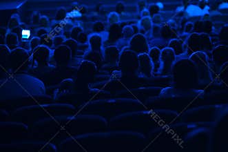 Audience in the cinema. Silhouette.