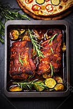 BBQ spare ribs with herbs and vegetables