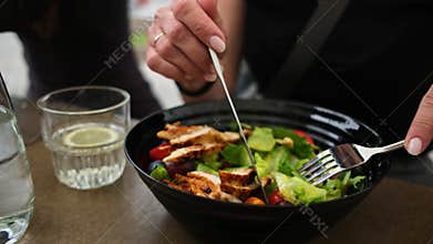 Woman Eating Fresh Chicken Salad In A Cafe