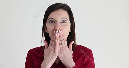 Young beautiful woman expresses shock and amazement