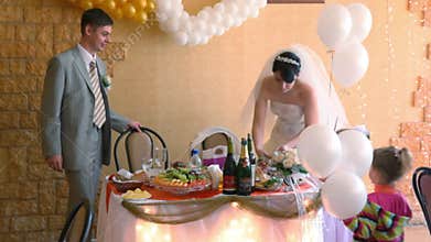 bride, bridegroom and two little girls with white