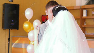 bride and bridegroom slow dancing