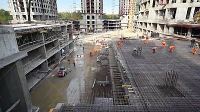 Several workers constructing metal frame on