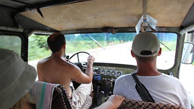 people riding off-road vehicle on farm road, video