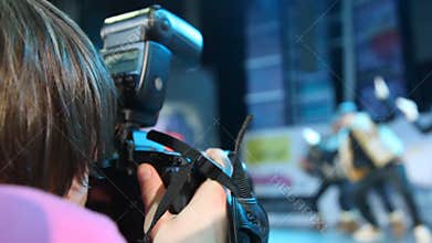 focus on photographer working at festival of