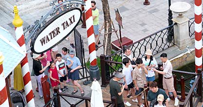Phu Quoc Island Vietnam 06.16.2024 people walk by show tickets get on water taxi gondola rides