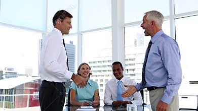 Businessmen shaking hands in the meeting room