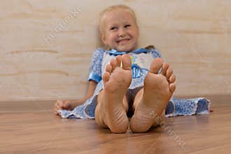 Smiling Young Girl Showing Feet on Camera