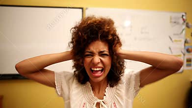Confused student looking at camera in classroom