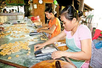 Coconut candy manufacture in Que Dua at Ben Tre , Vietnam .