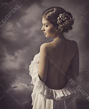 Woman fashion dress, retro hair style, naked back, historical romance portrait