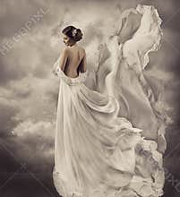 Woman dress, artistic white blowing gown, waving a