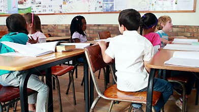 Little children talking in classroom