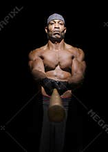 Baseball player pointing bat