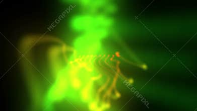 Moving blurred form of green and orange lights