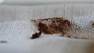 Stains appear on white fabric during cleaning process