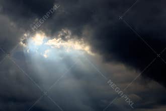 Sun Beam in Dark Clouds and Sky