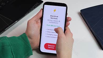 Booking an emergency electrician through a mobile app. Close-up of Electrical Services interface with certified