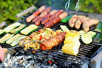 Assorted meat and vegetables on barbecue gril