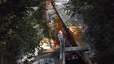 Flowing lime from a pipe and acid mine drainage reaction, water treatment