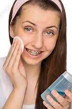 Girl with braces using makeup removal