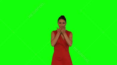 Attractive woman throwing red petals in the air