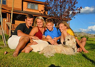 Family in front of home